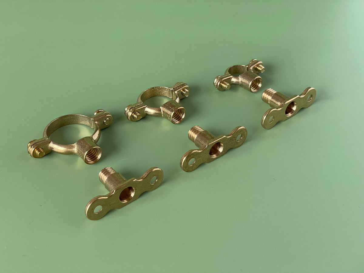 TALA brass pipe bracket in satin brass finish — slim profile for shelving and kitchen rails