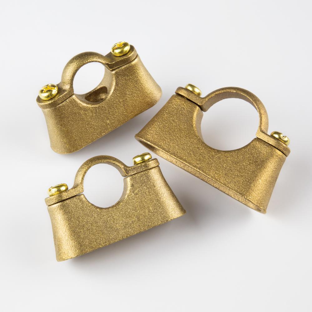 KATJA solid brass pipe bracket with a substantial architectural profile for statement shelf and entryway applications